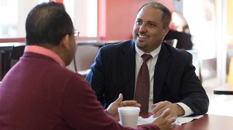 Male business owner meeting with a future employee.